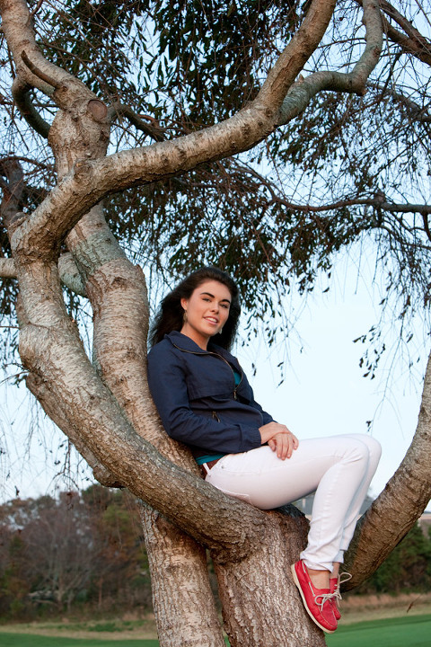senior photo sitting in tree