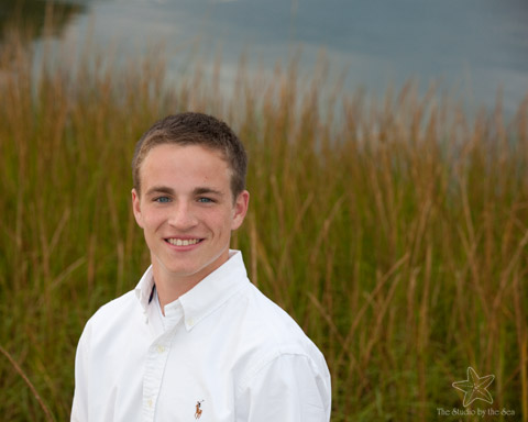 Senior boy in front of marsh
