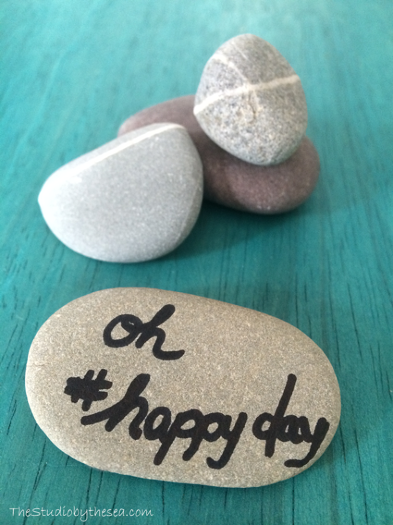 rocks with #happyday written on