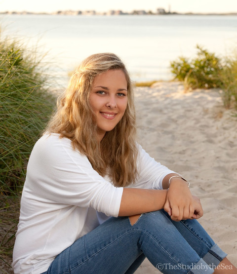 Teen sitting on beach