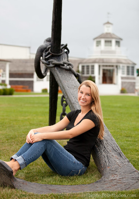 Teen sitting in large anchor
