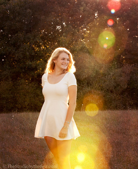 Senior girl with sunflare