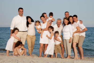 large casual family portrait on beach
