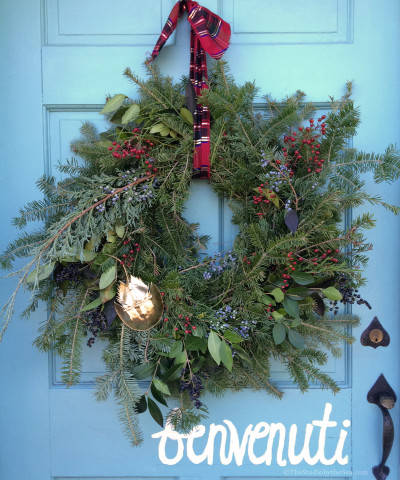 natural wreath hanging on door