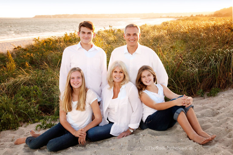 Family portrait at sunset on the beach