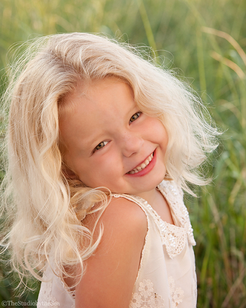 Sweet portrait of a young girl at the beach
