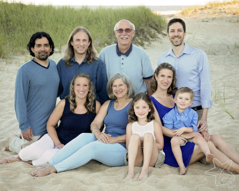 multigenerational family photo, family sitting on beach