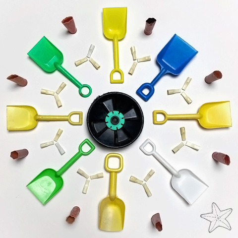 mandala of beach toys and plastic debris
