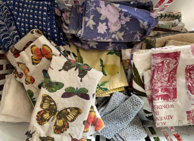 laundry basket full of cloth napkins and tea towels