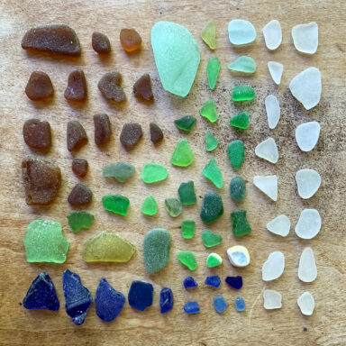 collection of seaglass laid out by colour in a square